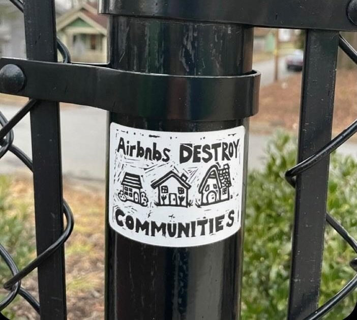 'Airbnb's destroy communities' 
Sticker seen in Asheville, North Carolina