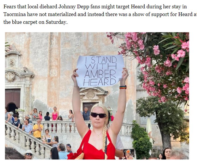 One simp holds up an Amber Heard sign. 

MSM : 'SO MUCH SUPPORT!' 😆 🤣