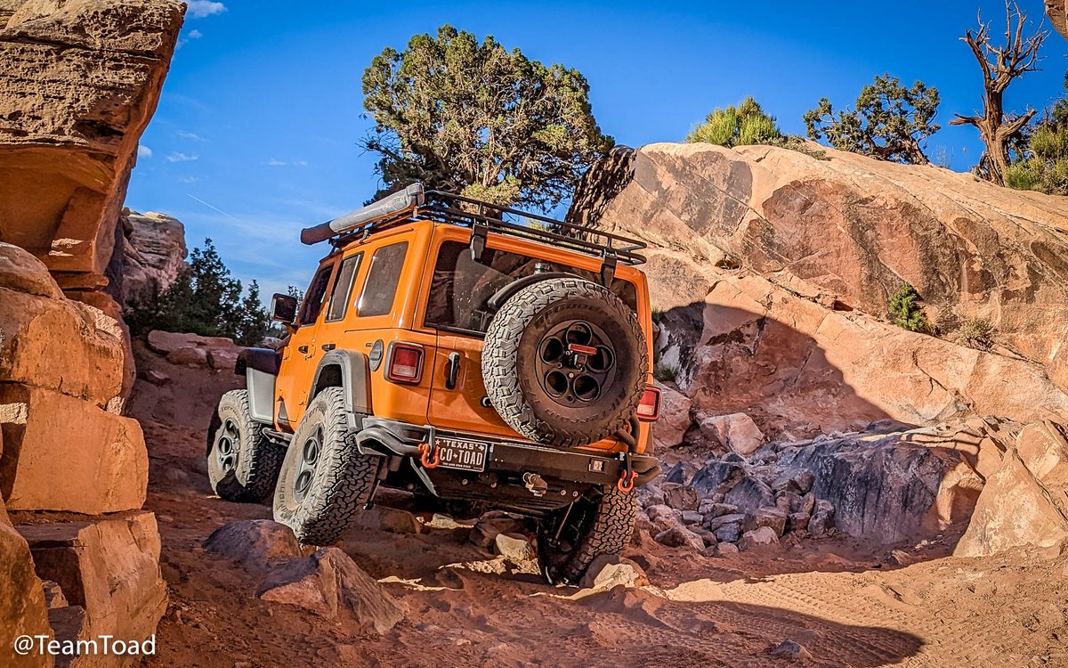 The 'EcoToad' is a 2023 JLURD with 37' BFG TAKO2s, AEV bumpers, hi-cap lift, and fuel caddy, a Warn Z10s winch, RedRock rack, and Rock Hard tube sliders. Here she is earning her first @Jeep #BadgeOfHonor on #ElephantHill in @CanyonlandsNPS .