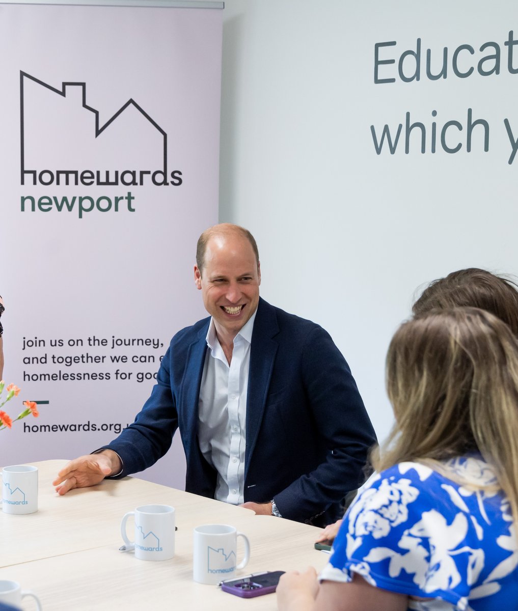 Prince William smiling while he talks to teachers at Maindee Primary School in Newport. 