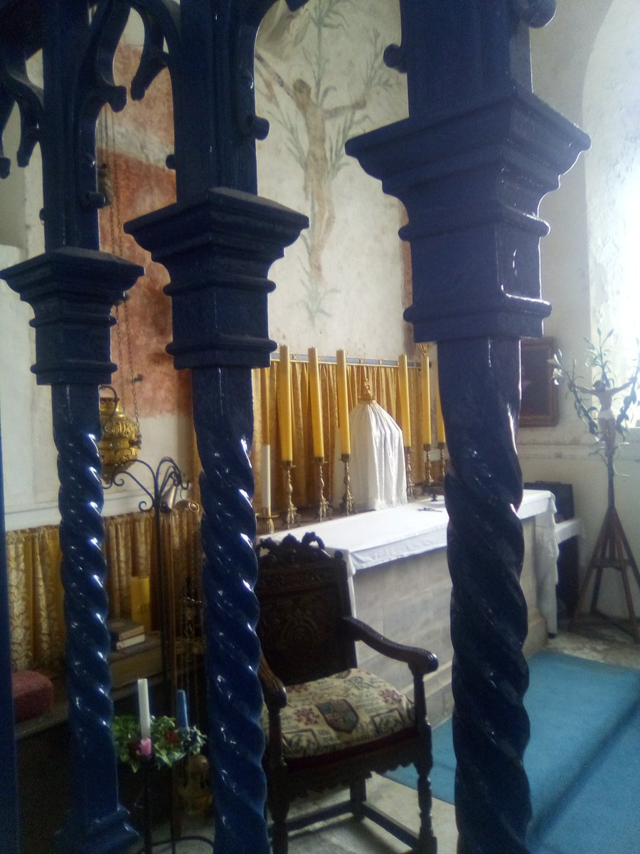 Went to my Mum and Dad's grave in Godshill Churchyard this afternoon and popped into the Church to a light a candle for them both infront of the Blessed Sacrament Chapel. Note the rare, beautiful medieval Lily Cross on the wall above the altar.