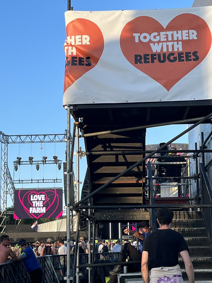 RefugeeTogether's tweet photo. Compassion just headlined Glastonbury⚡

At this year's @glastonbury, messages of HOPE took pride of place at the West Holts stage🧡

Everyday people want hope, not hostility. This government's cruel anti-refugee policies do not represent us. 

#TogetherWithRefugees, always. https://t.co/B88eO4Fok2