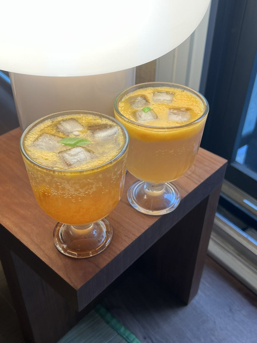 Mocktail hour! Honey yuzu + passionfruit + lime + black tea + tonic water and a tiny little basil leaf