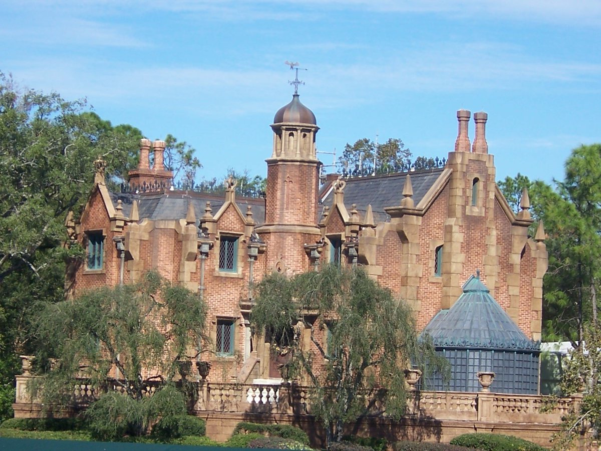 #PictureOfTheDay 
The stately Gracey Manor (AKA the #HauntedMansion) sits on the shore of the #RiversOfAmerica in #LibertySquare at #MagicKingdom Park in #WaltDisneyWorld Resort.  Shapes resembling #ChessPieces adorn the roof.