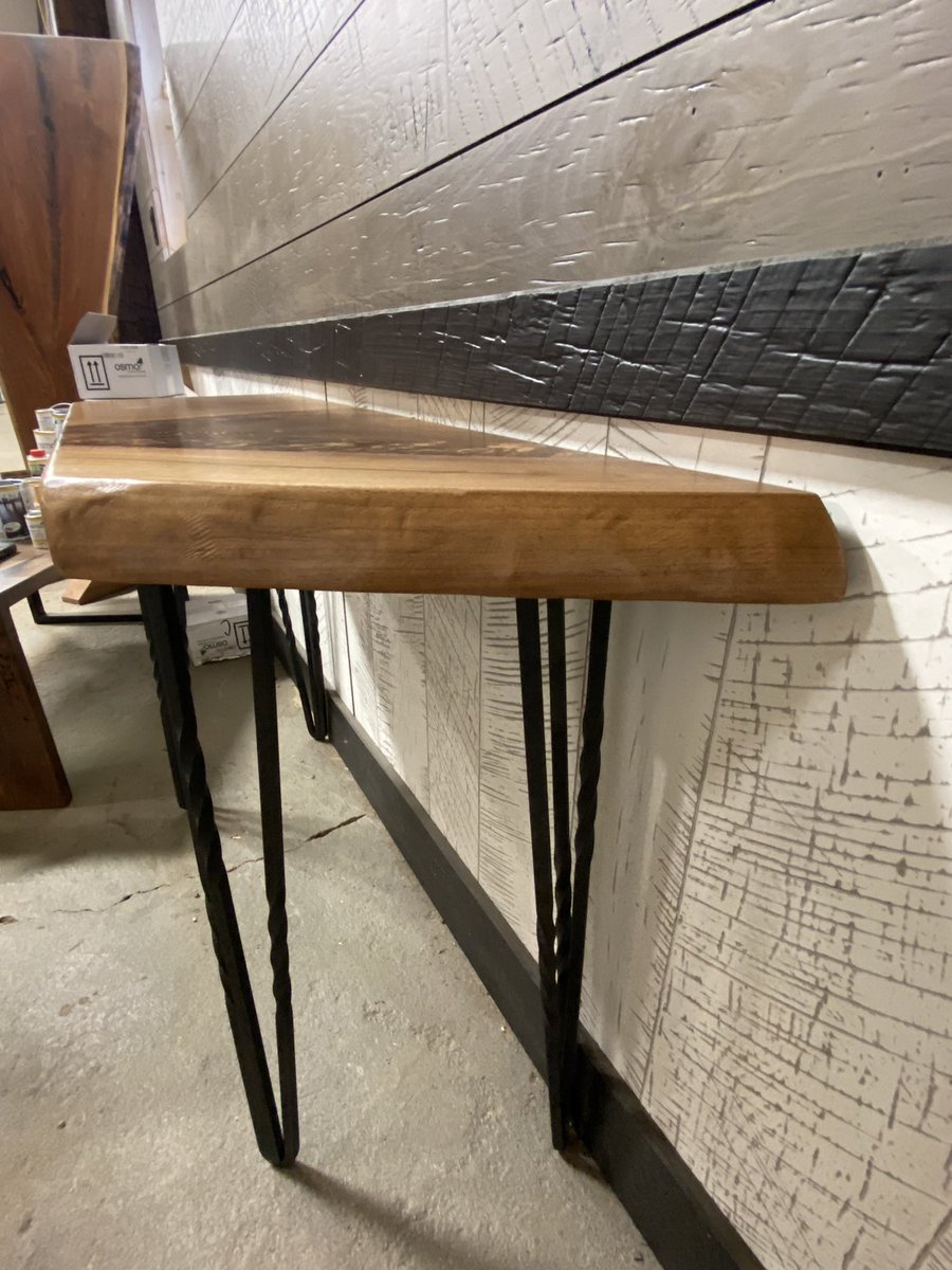 A beautiful sofa/entryway walnut table, gorgeous crotch grain figure.  Dimensions are 14” deep, 30” to 47” inches wide and 30” tall.  Black epoxy for filling the cracks and twisted hair pin legs for the base. #customcountrywoods #liveedgeslab #liveedgeslabs #blackwalnut #walnut