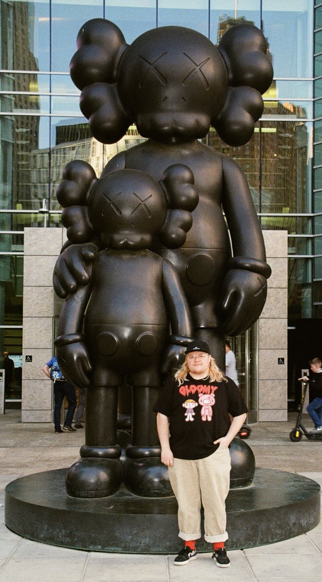 I am exactly 1/2 of a KAWS statue tall. that's epic