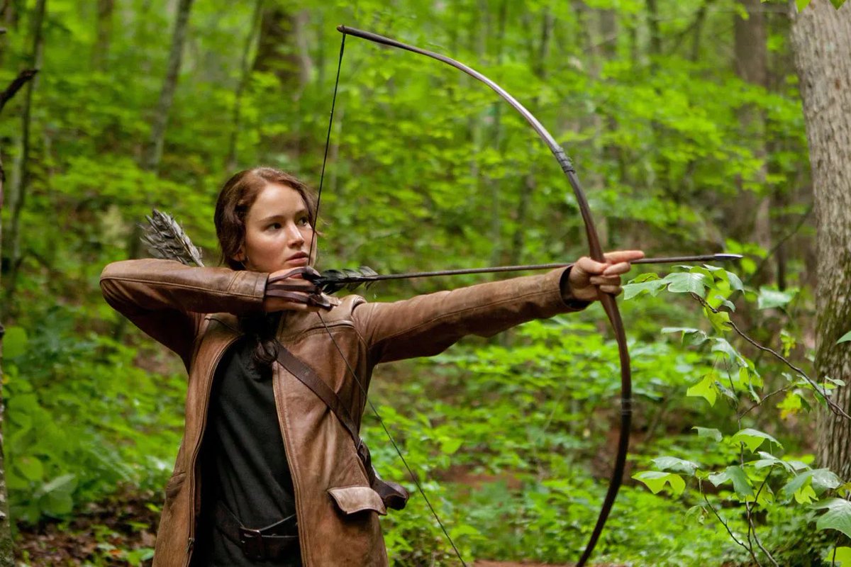 PopBase's tweet photo. Jennifer Lawrence reveals she kept Katniss Everdeen’s bow and arrow, as well as the boots from every Hunger Games movie which she keeps in her shoe closet. https://t.co/bIwZD6xYsD