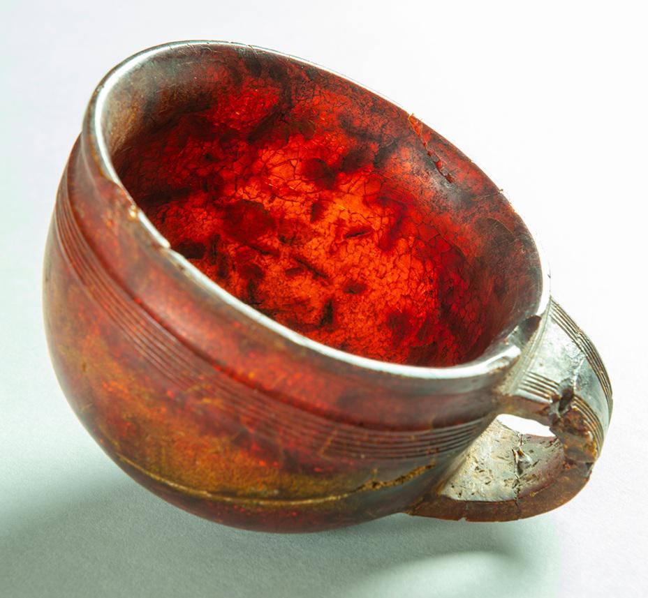 The 3,270-year-old Hove amber cup, found in 1856 in Hove, England. It's made of a single piece of amber from northern Europe, suggesting trade links between England and the Baltic even that long ago.

Hove Museum and Art Gallery