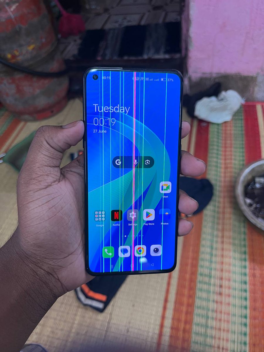 It looks like screen replacement done from a local shop & he tied the screen with different colour rubber bands.
#OnePlus