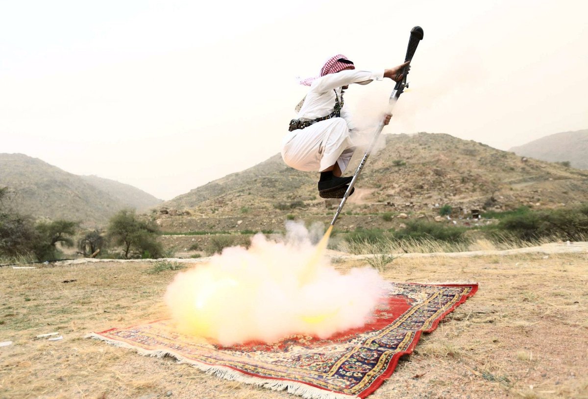 'A man fires a weapon as he dances during a traditional excursion near the western Saudi city of Taif, August 8, 2015. Saudis usually party in such excursions as they celebrate weddings or graduations.' 

📷: Mohamed Al Hwaity/Reuters