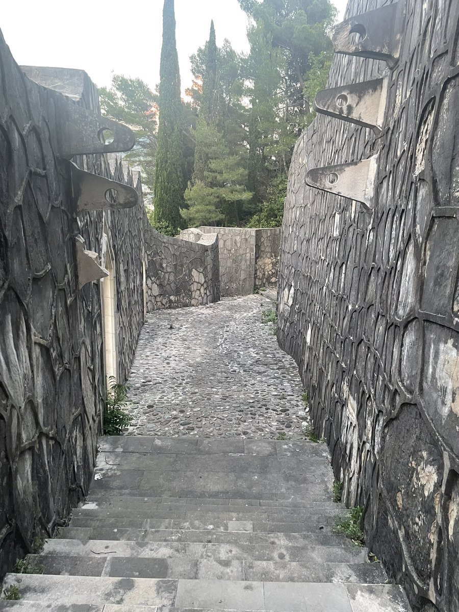 marjanacat's tweet photo. Hi @SpomenikDatabse, I visited Partizansko Groblje in Mostar the other day.  I can still see the beauty of this spomenik despite the weeds and fig trees growing wild. https://t.co/86ehIMWwC3