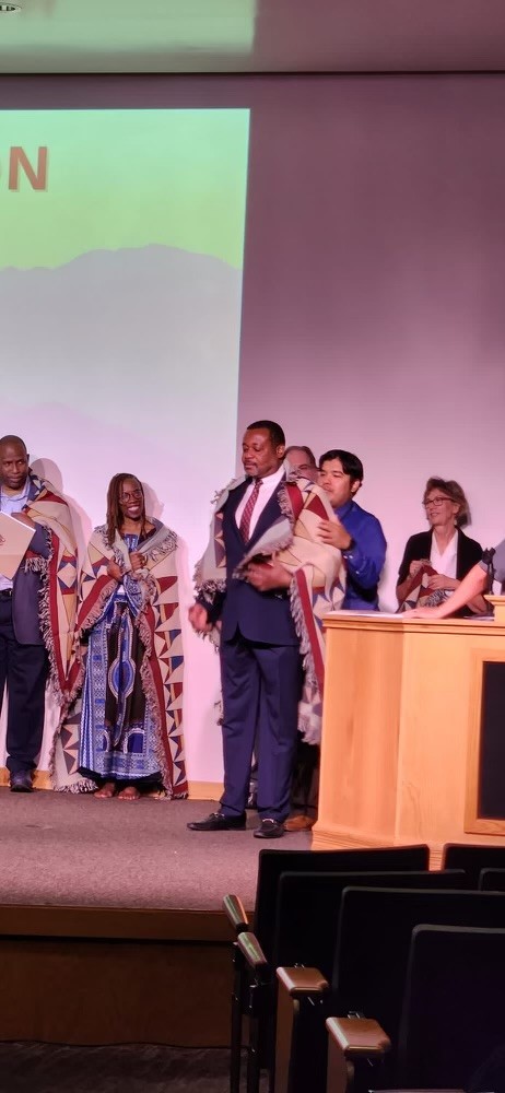 APA's tweet photo. Historic moment at the Society of Indian Psychologists annual convention��APA leaders present a formal apology for the association's contributions to harm against First Peoples and commit to a path of remediation and reconciliation. https://t.co/P276a2gvg0