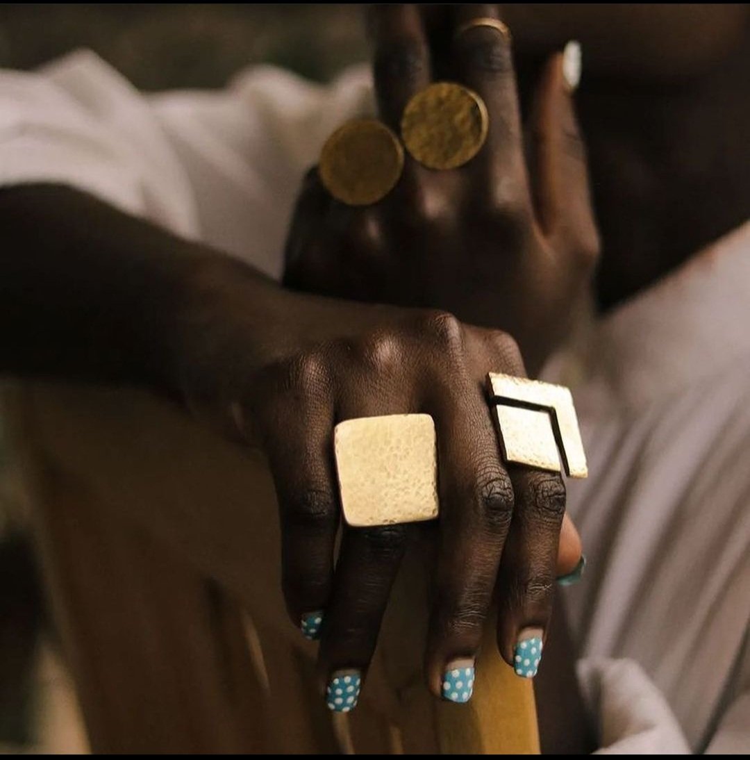 BLING BLING repost from <a href="/_kwezi/">'KU♔</a> and <a href="/sharown_vii/">sharon eryenyu</a> !

Sharon is one of our absolute fave female African artists &amp; she is rocking her WAZI rings from @murembocollection  as photographed by the phenomenal <a href="/_kwezi/">'KU♔</a> !

#brassjewelry 
#uniquejewelry 
#handcraftedjewelry 
#brassjewelry