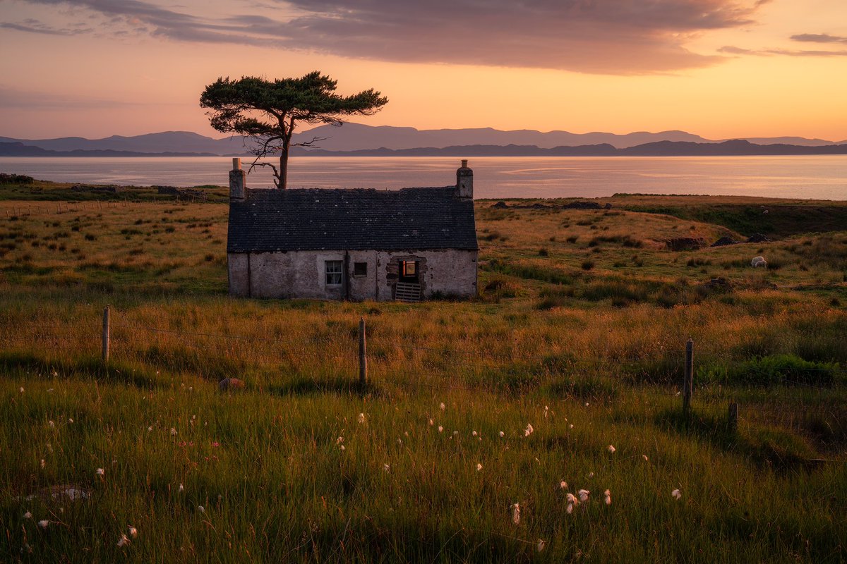 A derelict cottage left abandoned on the far western coastal road between Sheildaig and Applecross. The cotton grasses made a nice addition to the foreground. Skye can be seen in the distance. <a href="/VisitScotland/">VisitScotland</a>