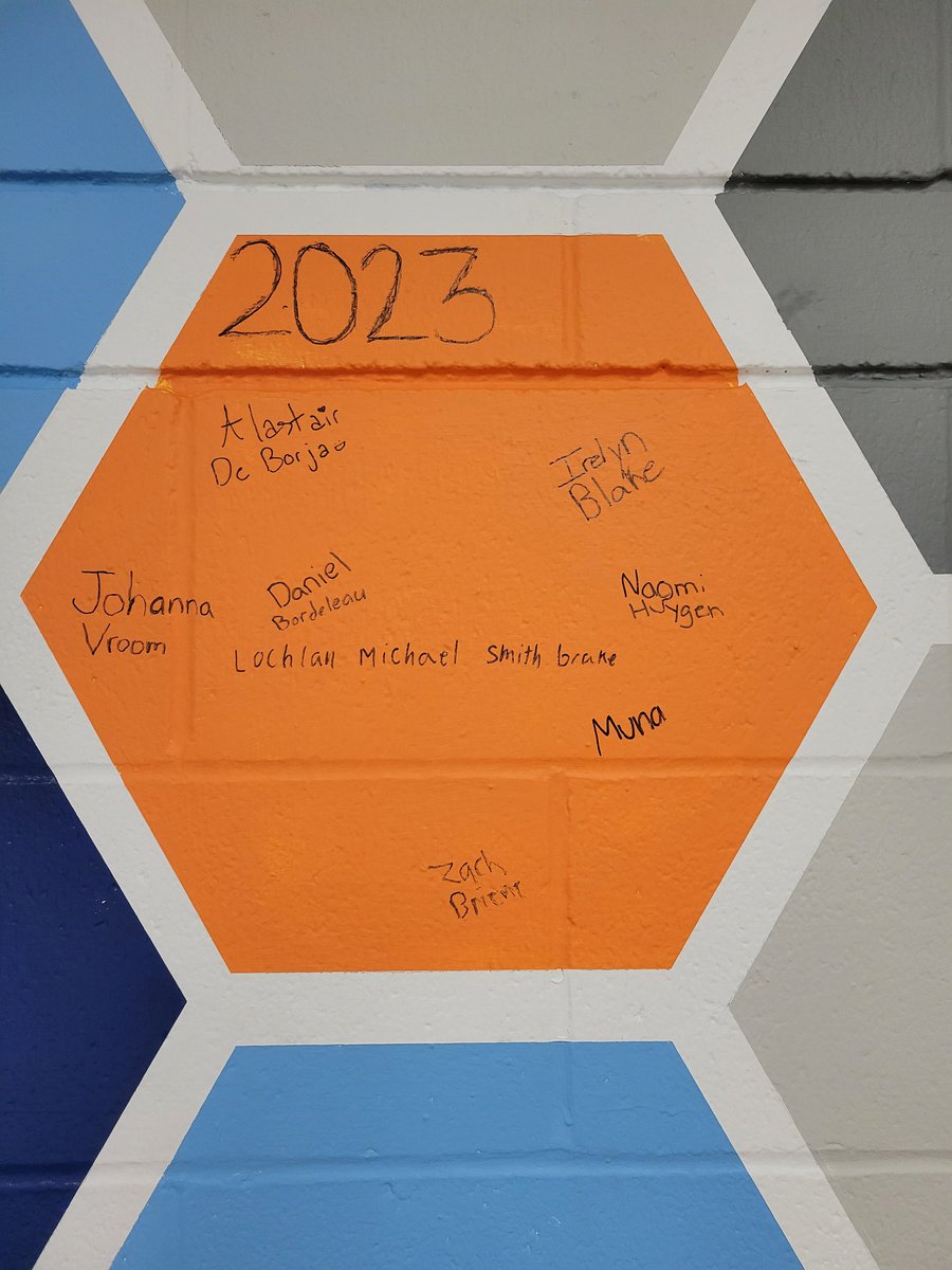 Grade 9 @ChristianFMPSD sign the 1st square of the legacy wall.
