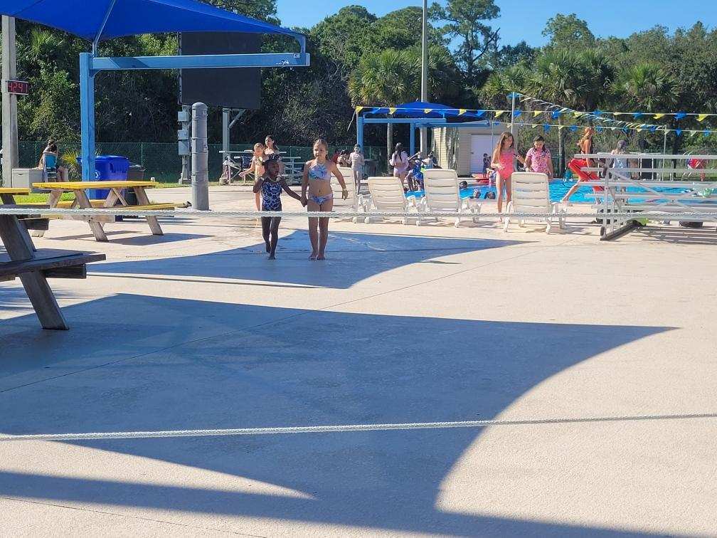 Extended Day Summer Camp enjoying cooling off at the pool!