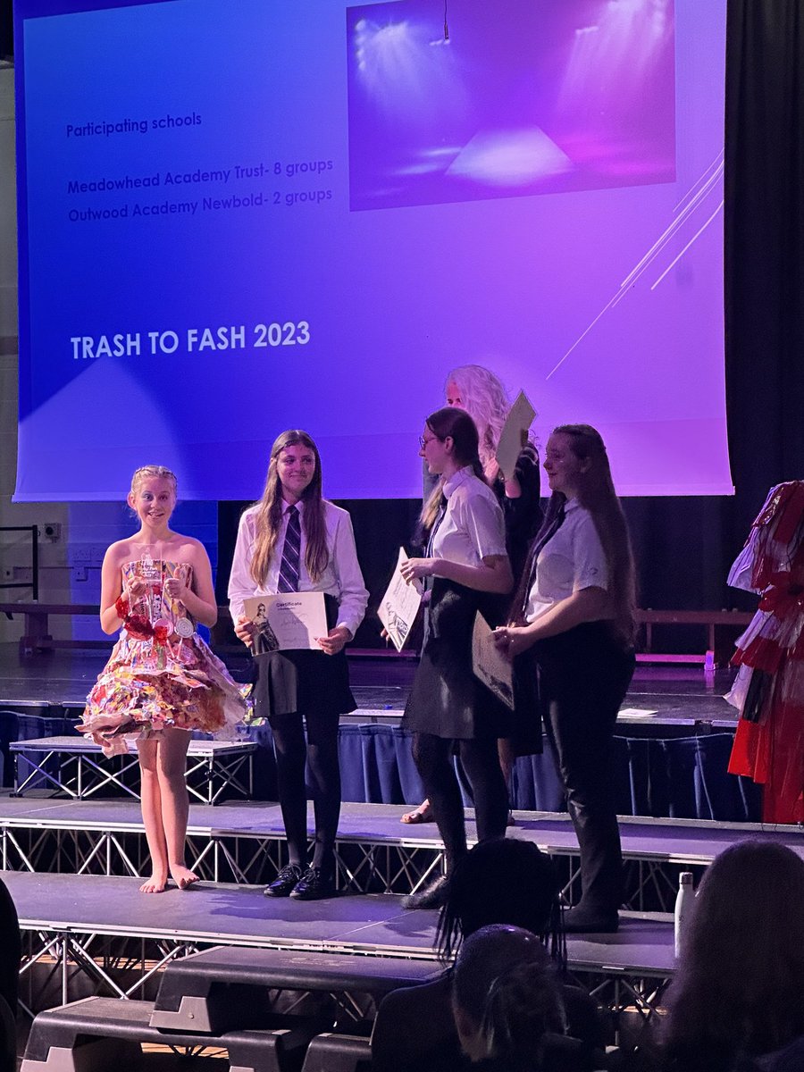 art_newbold's tweet photo. We also came 3rd with this dress at the trash to fash competition. Check out the lovely Fearne C modelling…the shock on her face when she received a trophy! The girls were all over the moon…I had to get involved and have some glitter on! #proud #oan #thisiswhyIteach https://t.co/IrX6pOfTK7