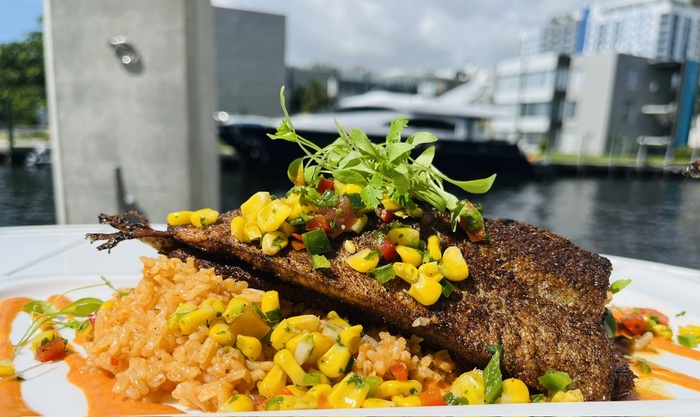 Our weekly special is here! Enjoy blackened trout and red pepper rice topped with roasted corn salsa. Delicious! #Boathouse #RiversideHotel #LasOlas