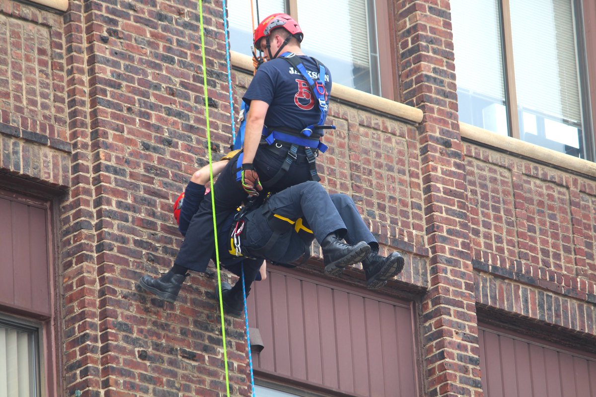 Firefighters soared above #JacksonMi today, practicing rescues at the Blake Building. The joint training gave Jackson, Summit and Napoleon firefighters experience in rope rescue training.  This is used for people trapped in a high place that can't be reached by a ladder truck.
