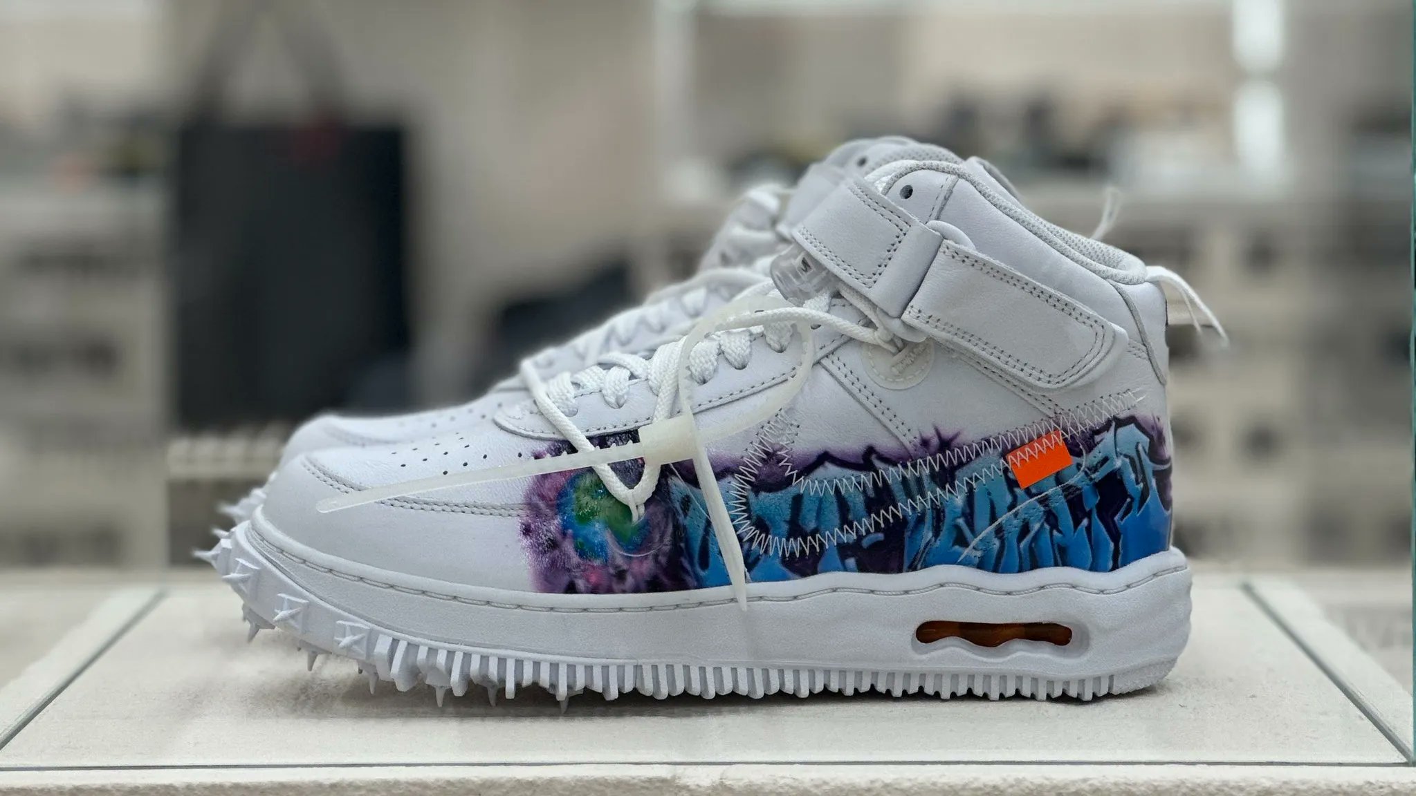 The Off-White x Nike Air Force 1 Mid 'Graffiti' Sneaker Is Out Now