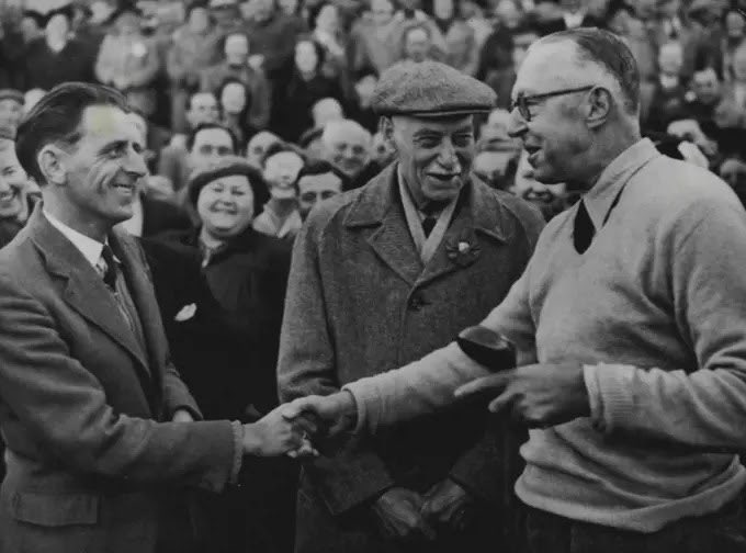 TheGolfDivoTee's tweet photo. 1951 and Francis Ouimet becomes the first American to be elected captain of the Royal and Ancient Golf Club.

Here he shakes hands with Arthur Speight a local bus driver who retrieved Ouimet’s golf ball at the driving in ceremony. 

Willie Auchterlonie looks on. https://t.co/XbIvzxUmZw