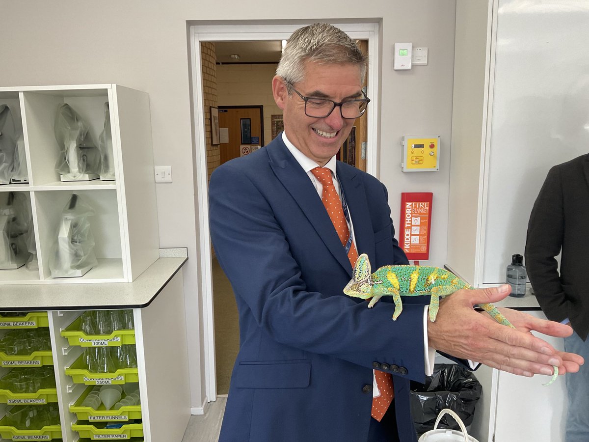 StSwithunsBio's tweet photo. “Mango” the biology department rescue Yemen chameleon was the star of the open day! With Mr Yates and Mr Hansen, showing the visitors how to hold him. #itswhoweare #chameleon #openday https://t.co/AErCqFhbMk