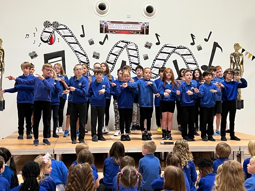 NessCastlePS's tweet photo. Wow wow wow! Our children did us proud today, performing wonderfully in front of parents, carers and invited guests at our End Of Term Celebration and Official Opening Ceremony! The future's bright at Ness Castle with these superstars! 💙🦕🏰 https://t.co/w9DbuB1vLR
