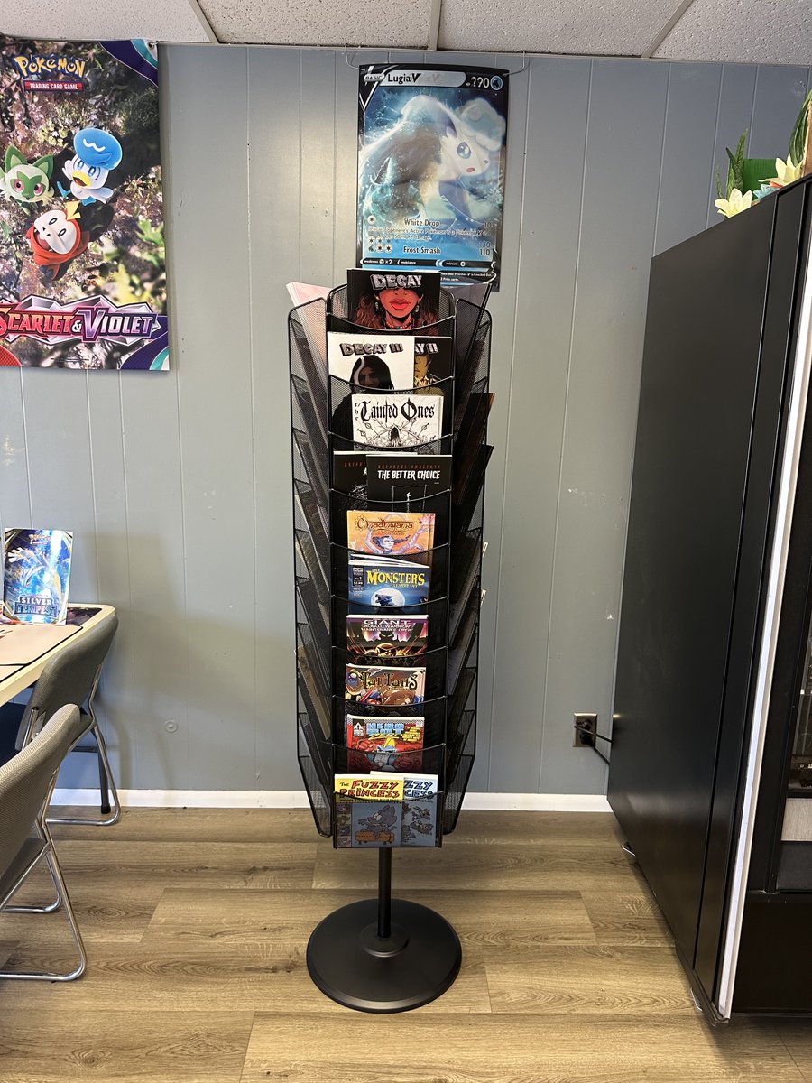 We are excited to announce that we now have a spinner rack full of great comics and graphic novels at Rip N Card Trick in McMinville, Oregon
