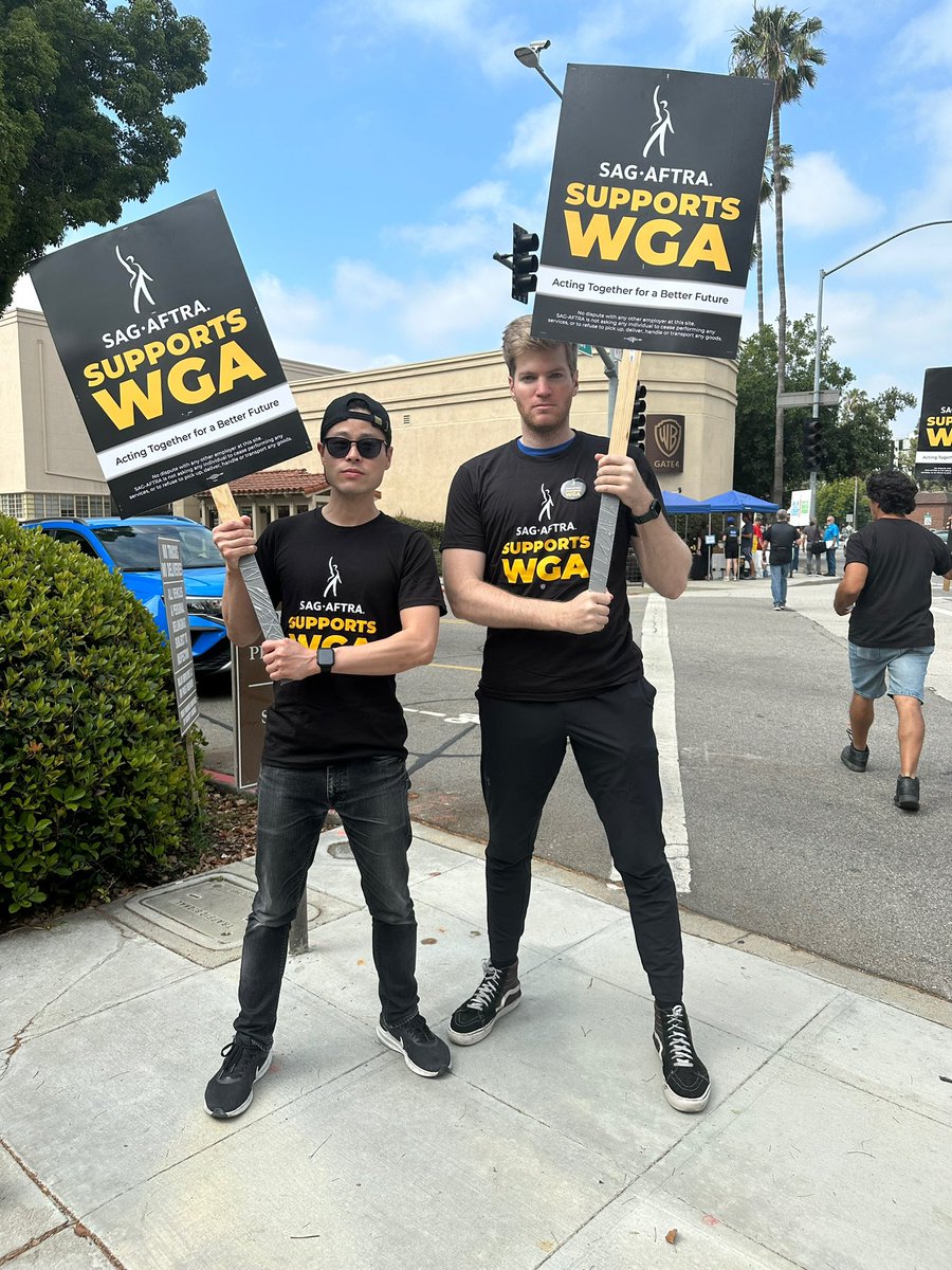 Had a blast supporting the #WGA and repping the black and gold on the picket lines with my dear friend @pauldateh we worked on a short together in 2019. It was an honor spending time with you again my friend! #SAGAFTRAStrong