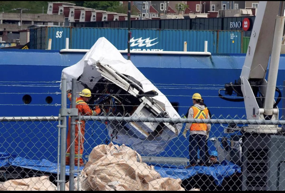 the first photos of the mangled titanic sub have finally been released after being taken to shore