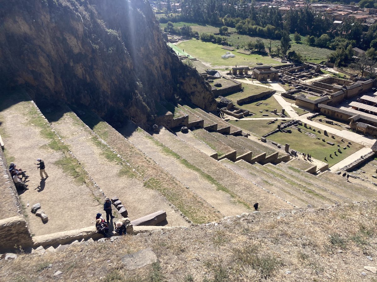 Standing in front of 60+ ton blocks at the Temple of the Sun in Ollantaytambo. Far up the mountain, many of us could barely get up there. How did they get these megalithic stones up this high?