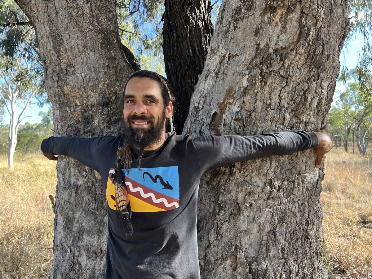 Waddananggu's tweet photo. Experts say box trees growth in semi arid environment is roughly 2mm a year. This old tree is around 2.5m in diameter. I can only imagine how old this tree is. My right to touch and connect with the same trees my ancestors did, trumps Adani's right to bulldoze them #Waddananggu https://t.co/UrmOXWG7Fc