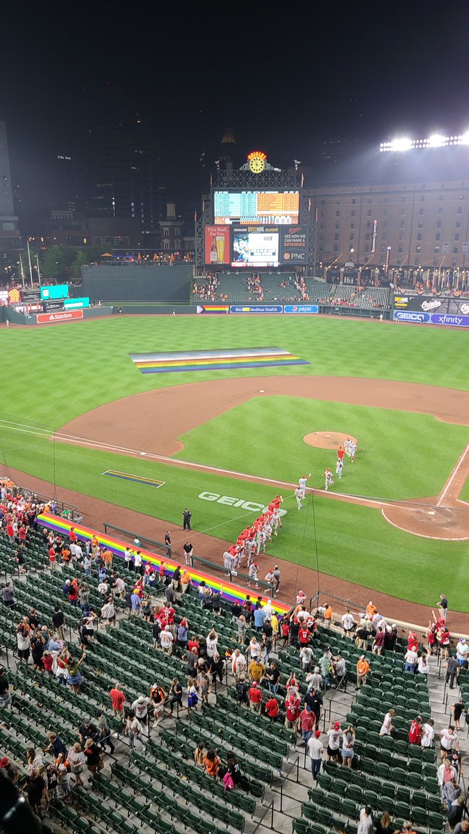 wilkinsonja2's tweet photo. The very conflicted feelings I had watching my hometown team beat my new home team (while wearing both Reds and O's gear) - @RentheadZen - and woo Orioles' Pride Night! https://t.co/vAqRifgRfs