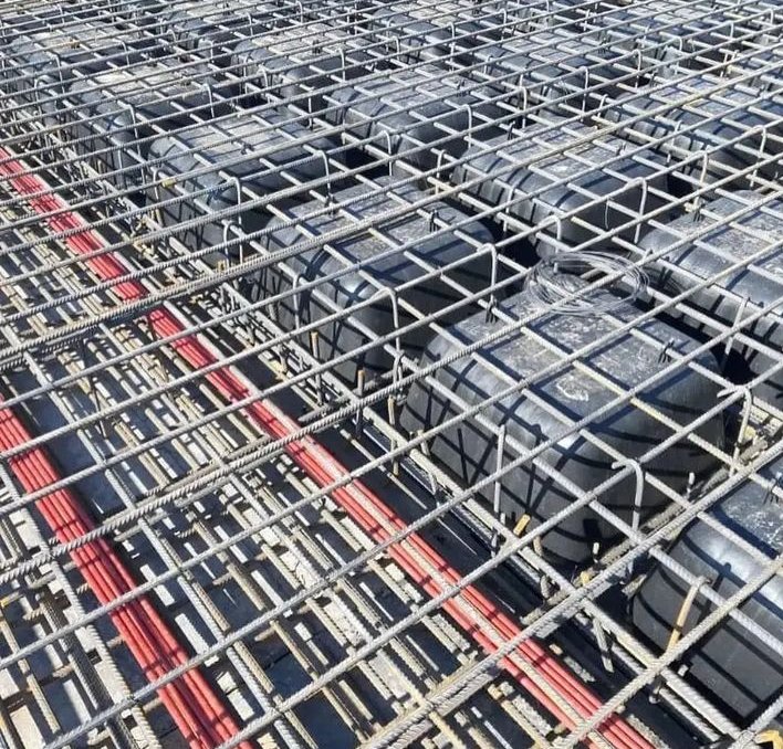 Traditional construction of waffle slab system includes the storage of materials, establishment of supports and formwork assembly in situ for worker convenience. Consequently, reinforcement is cut and tied followed by the insertion of opening steel cylinder into the reinforcement