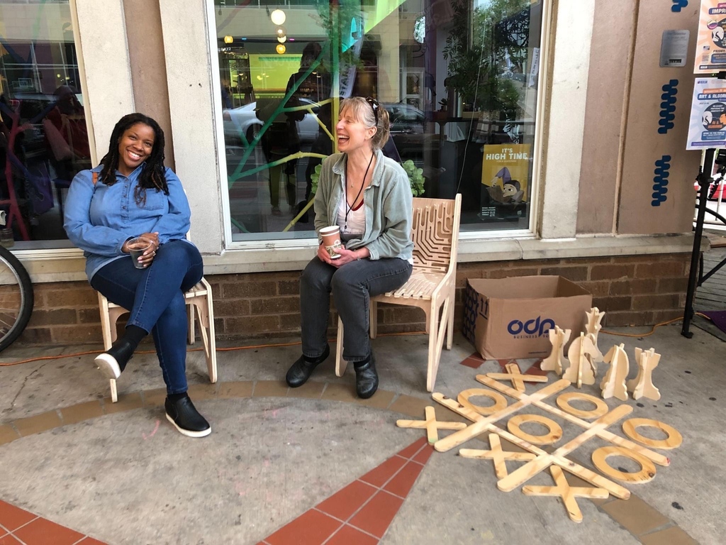 Go to the wikiblock site to download free plans of placemaking furniture that you could use to reimagine your town with.

Then buy a sheet of plywood and find a local makerspace that has a CNC router and - voila - you have a giant lego set you can assemble of the furniture.