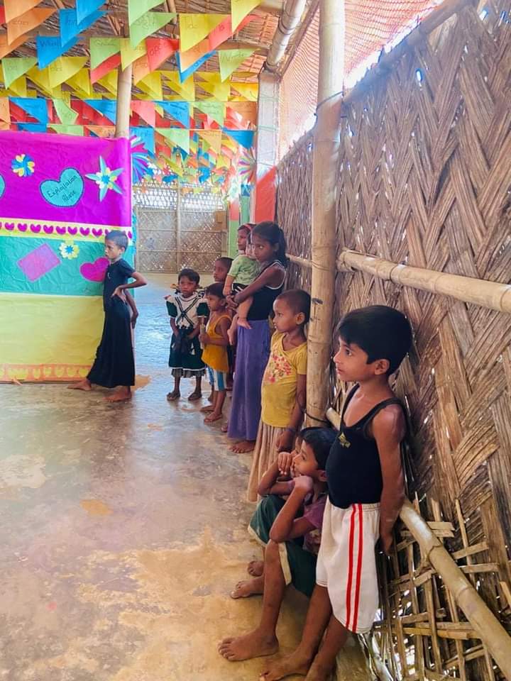 PialShil's tweet photo. They are some adorable spectators from our music class at The Rohingya Camp. They never miss any of classes. Whenever we call them to join they just ran away and again come. They love to join and enjoy class this way. This is how music draws everyone closer.
@UNHCR_BGD @UNICEFBD https://t.co/HYrayAr7AN