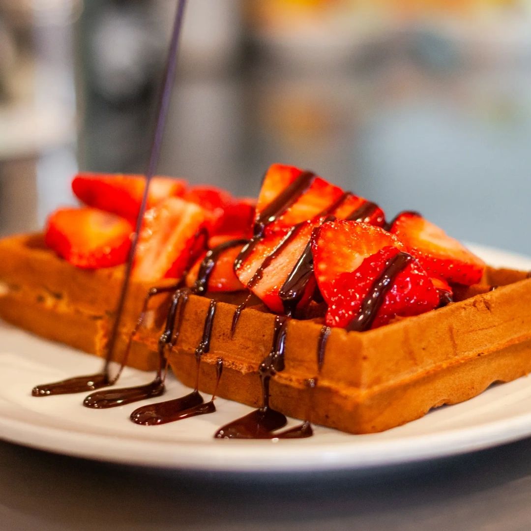 If you have that nagging feeling at the back of your mind that you're missing something today, you are: Our delicious strawberries and Nutella Belgian waffle. We can fix that for you with one visit to our place.