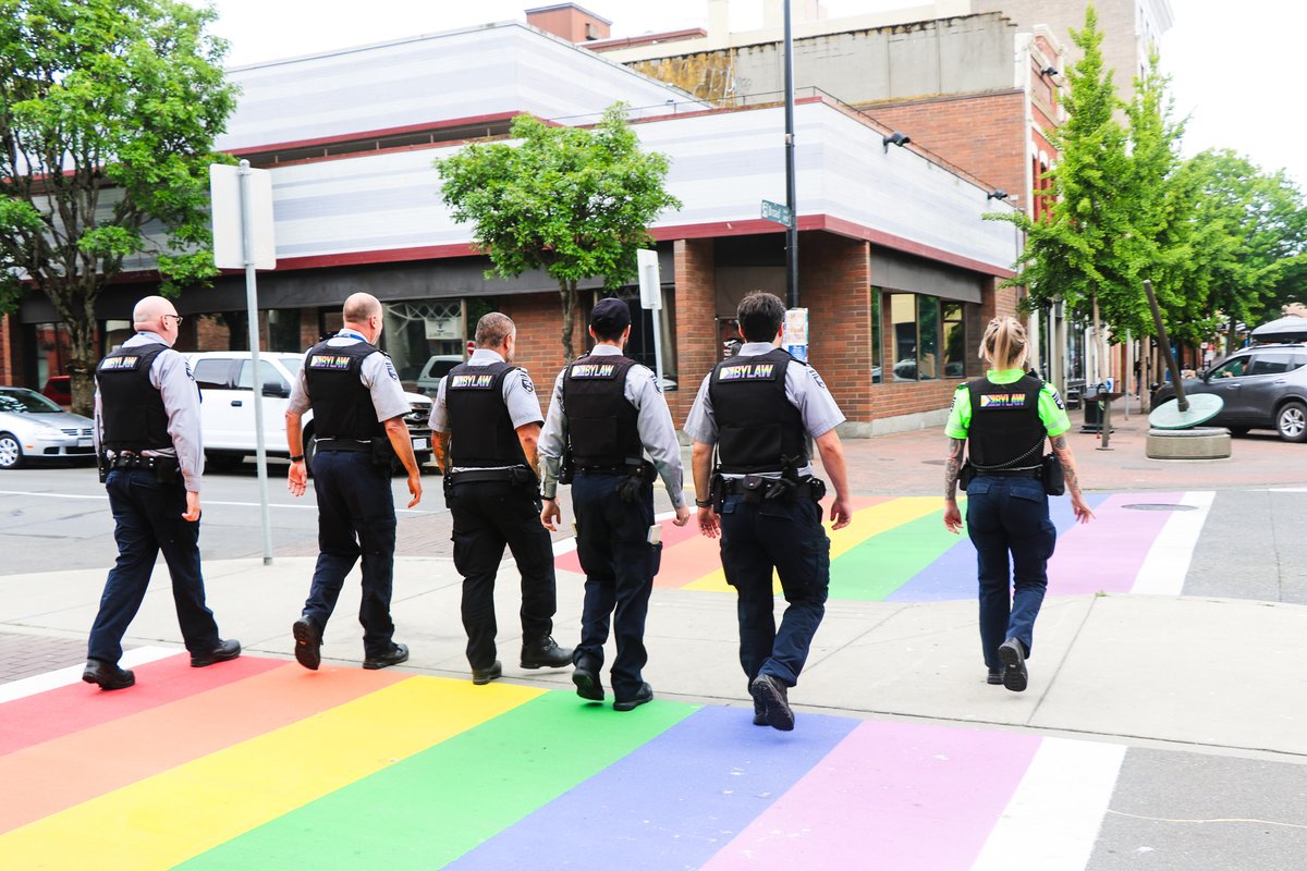 The crosswalk at Pandora Ave & Broad St received a rainbow refresh just in time for #PrideWeek in #yyj, and so did the City’s bylaw officers, seen here sporting their new Progress Pride Patches.