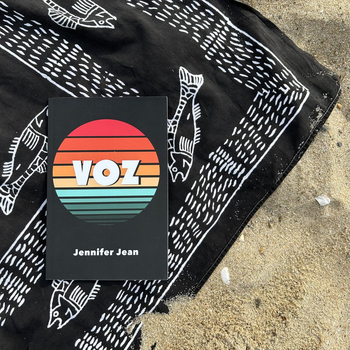Summer reading: VOZ by Jennifer Jean (Lily Poetry Review Books, 2023), a book of music, California, foster care, the Pacific, family, summer camp, saturation, Disney, dreams, car rides, horses, raging, and singing. ♥️ @fishwifetales @PoetryLily