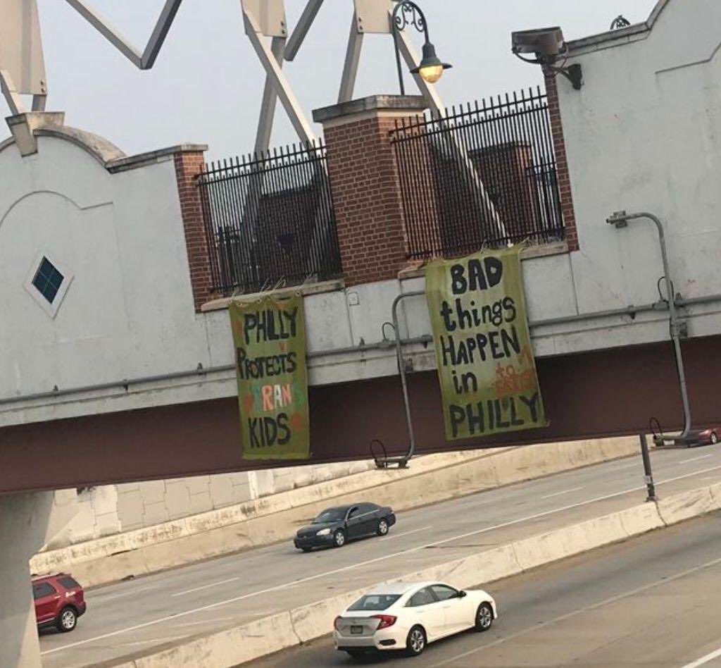 GrimKim's tweet photo. Banner drop over I-95 this morning. The M4L hate summit begins tonight with a opening reception at @AmRevMuseum. Show up at 5pm to, uh, “welcome” them. 

“Philly Protects Trans Kids”

“Bad Things Happen to Fascists in Philadelphia” https://t.co/r03WfLGog7