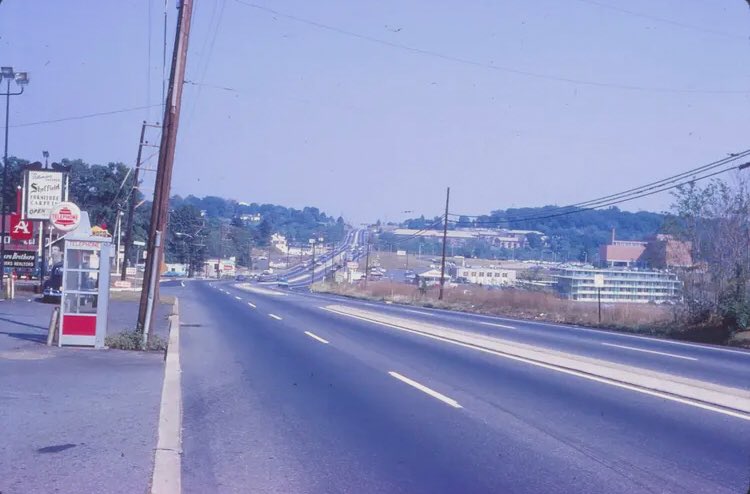 RootsDelco's tweet photo. Throwback Thursday - takes us back to the year of 1968 at the stretch of Baltimore Pike around Riddle Hospital.   Hospital on your right, the clover leaf way in the distance, and no Granite Run Mall since it didn’t open until 1974.  Check out that okd pay phone booth! 😳 #Delco https://t.co/LyO7CCaz22