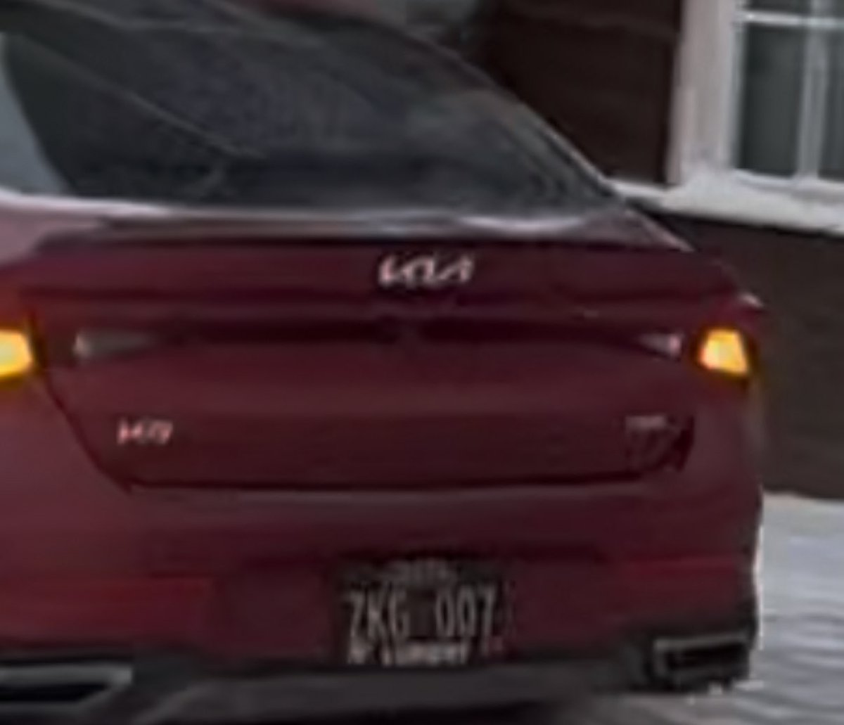 Red Kia, plate # ZKG 007