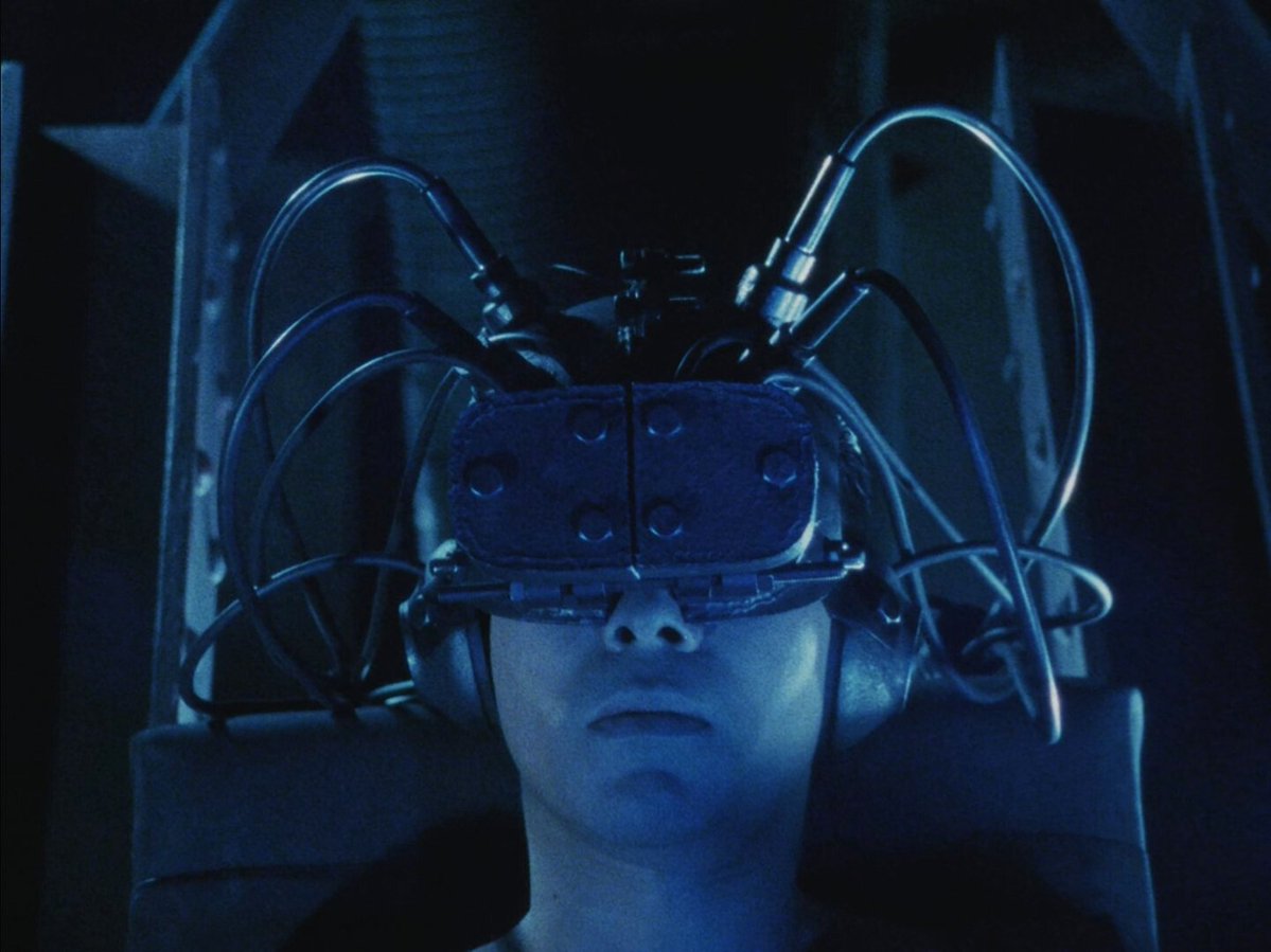 A salaryman whose child is abducted by a techno-gang, triggering cybernetic mutations. Flesh converts to hardware, body arsenal of tech weapons. The man must face industrial hive-minded goons in a future Tokyo of rampant cyber-flesh violence.  

Tetsuo II: Body Hammer, 1992