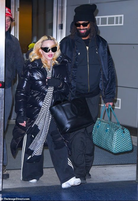 NewMadonna1's tweet image. Madonna (looking hotttt) and boyfriend Akeem Morris at the JFK airport in New York City today