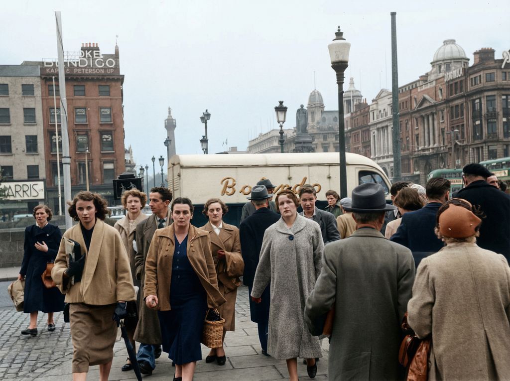 1954 , Rush Hour Republic

Christiaan van Heijst snaps Dubliners cross O’Connell Bridge in quiet formation, strides brisk, coats sharp, gazes fixed. Post-War austerity lingers. Behind them, Nelson’s Pillar still stands, for now. Ireland steps, cautiously, into a new future.