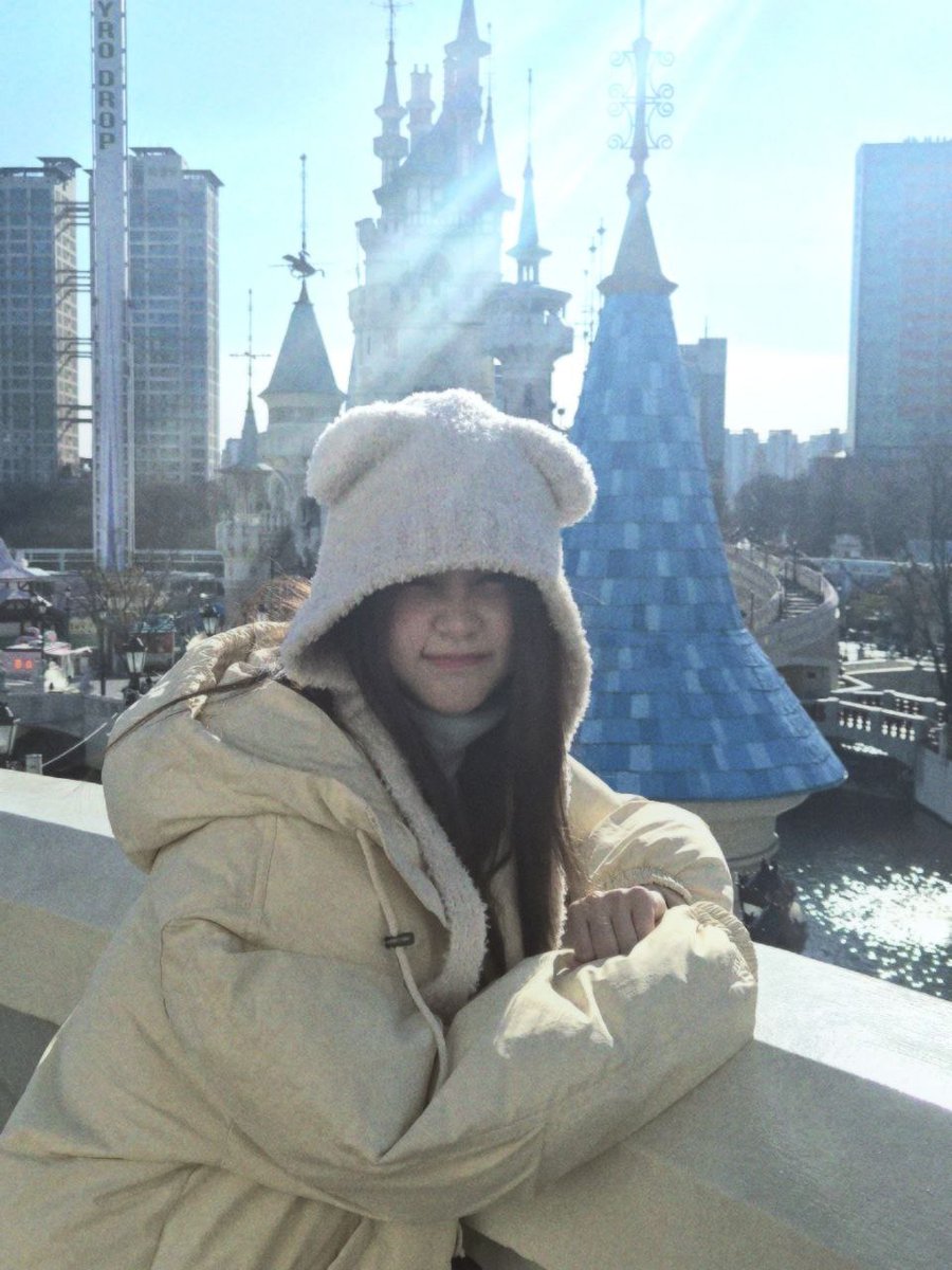 with my dressed warmly and this plush cap, I shielded myself from the icy wind's rays. by a pleasant smile on my face, I preserved the memories behind the palace.