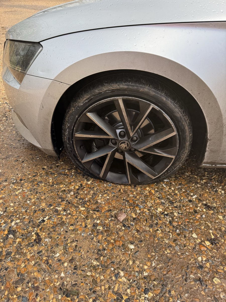 Brown_Clare's tweet photo. @WokinghamBC this is the damage to our car just now after driving  down Hinton Road  towards Waltham Road - massive pothole - can you get this coned off asap https://t.co/Rf2eEu2ArQ