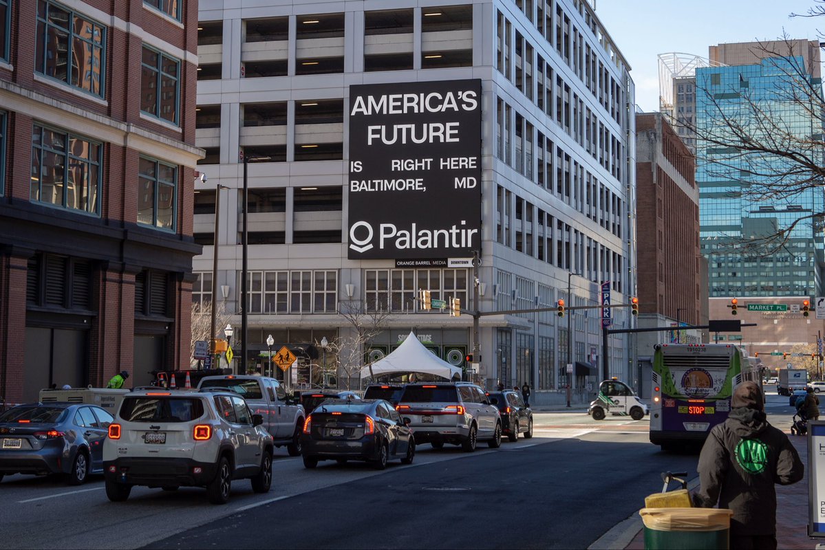 eliano's tweet image. you may have seen the new Palantir ad campaign 👀 

ads were placed in historic industrial powerhouses across America because Palantir believes the AI revolution should bring immense prosperity back to these regions.

in the past, cities like Baltimore and Youngstown were gutted…