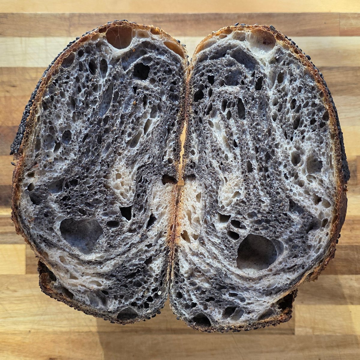 Wow your eyes and taste buds with this Black Sesame Swirl Sourdough. It's easy to make black sesame paste with a spice grinder or food processor, and laminating two doughs together makes cool swirls. We also tested different seed-crust "glues"🌾b7p.org/dhzhW