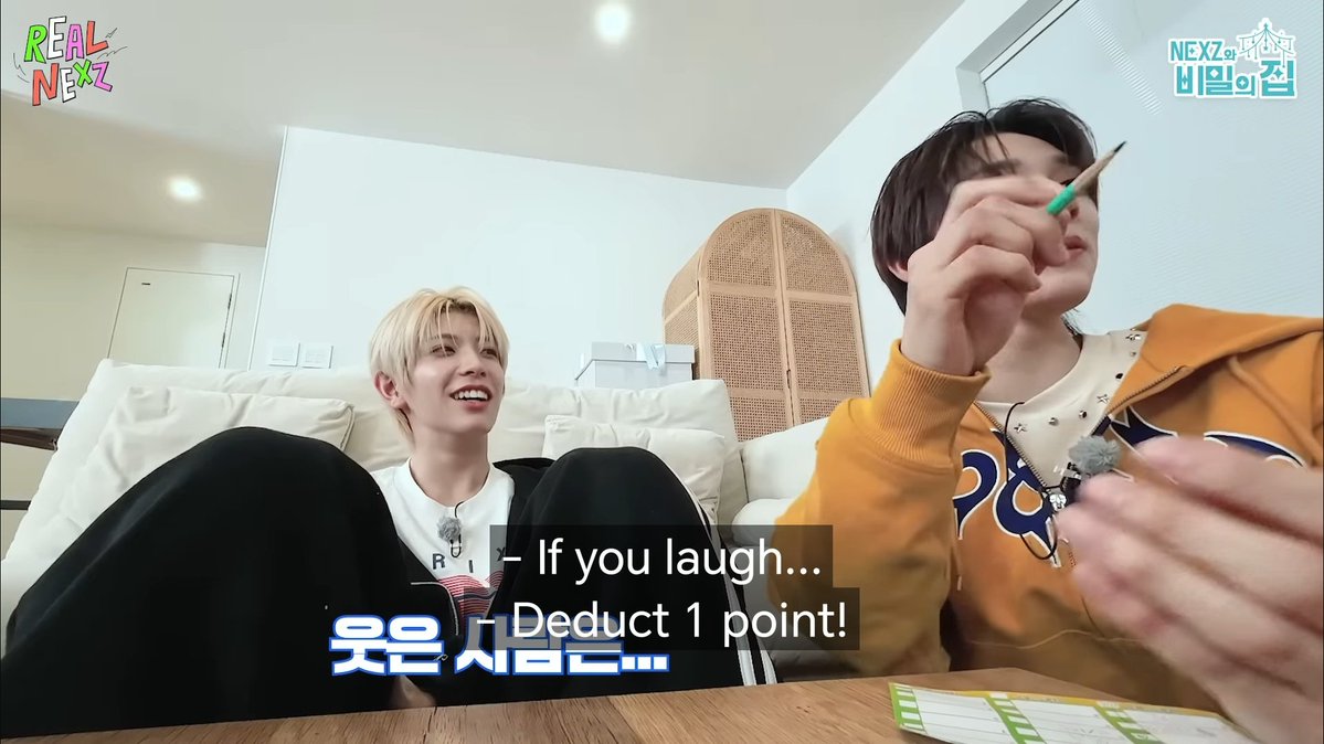 yuharuism's tweet image. it's funny how everytime nexz mentioned try not to laugh challenge, the screen shows hyui smiling knowing well he's at risk 😭